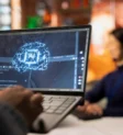 call-center-worker-using-ai-tech-laptop-reply-customers-closeup-scaled call-center-worker-using-ai-tech-laptop-reply-customers-closeup-scaled