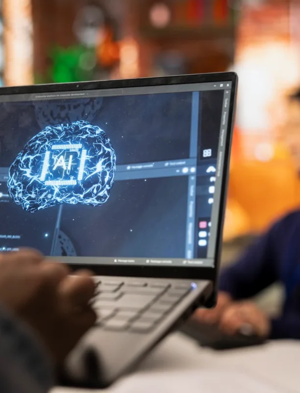 call-center-worker-using-ai-tech-laptop-reply-customers-closeup-scaled